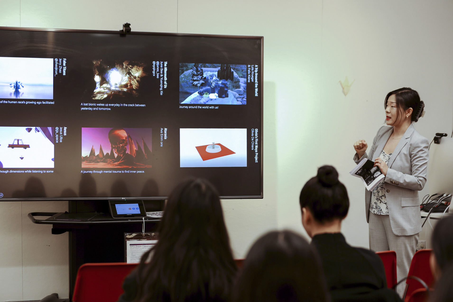 Professor Snow Fu talking near a large television